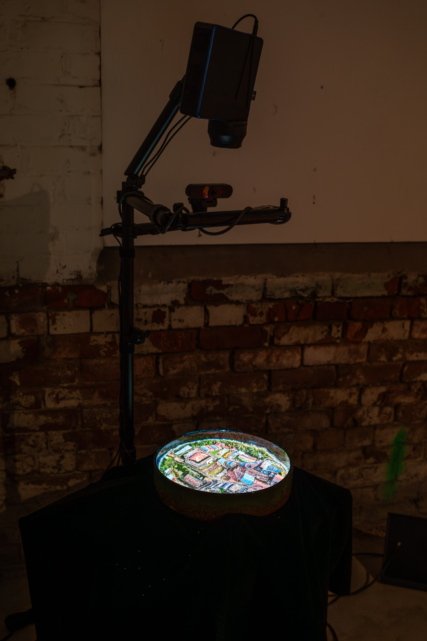 Experimance interactive AI installation by Ryan Kelln at Factory Media Centre, featuring projected visuals on sand surface