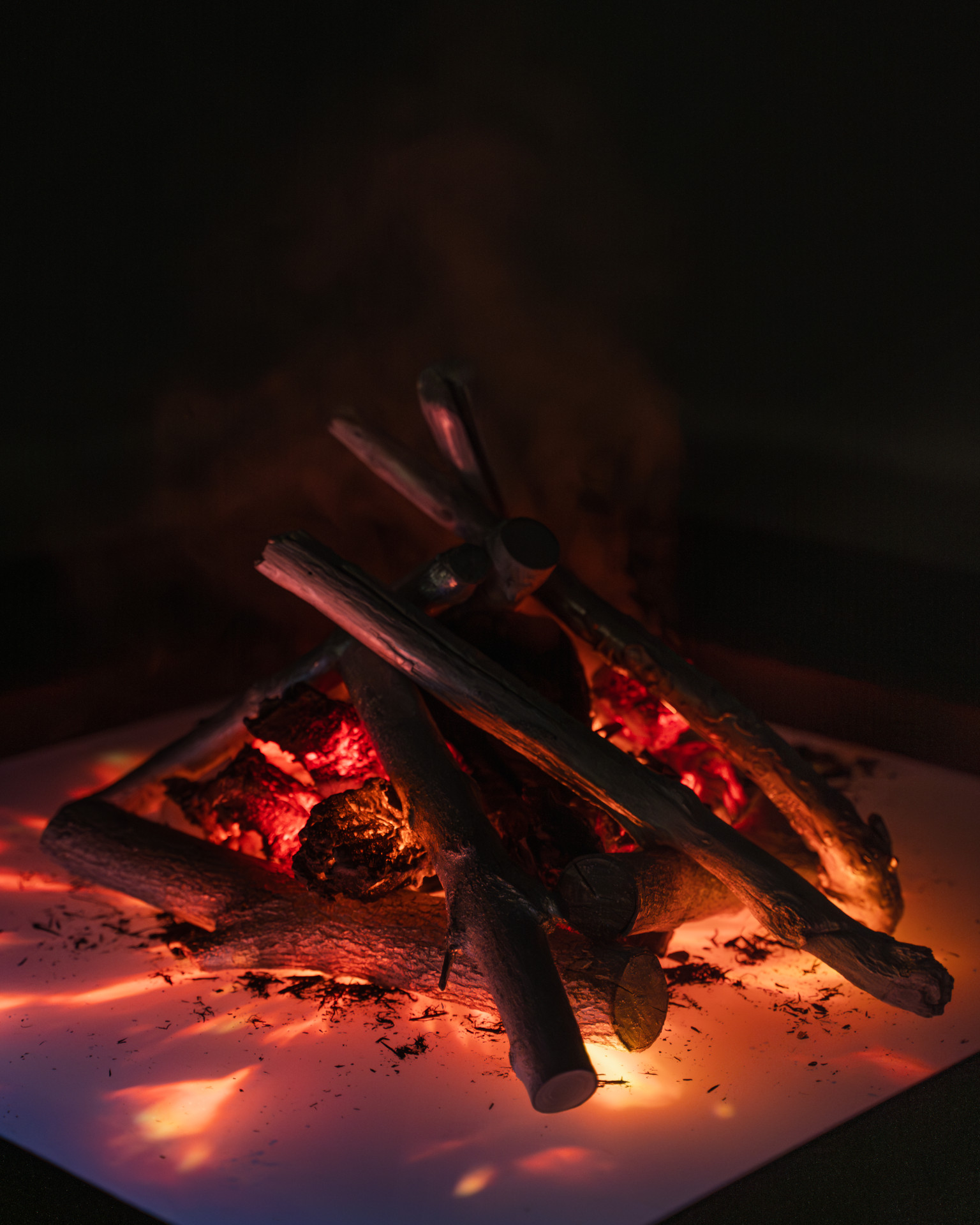 Feed the Fires interactive AI installation firepit with mystical flames and smoke